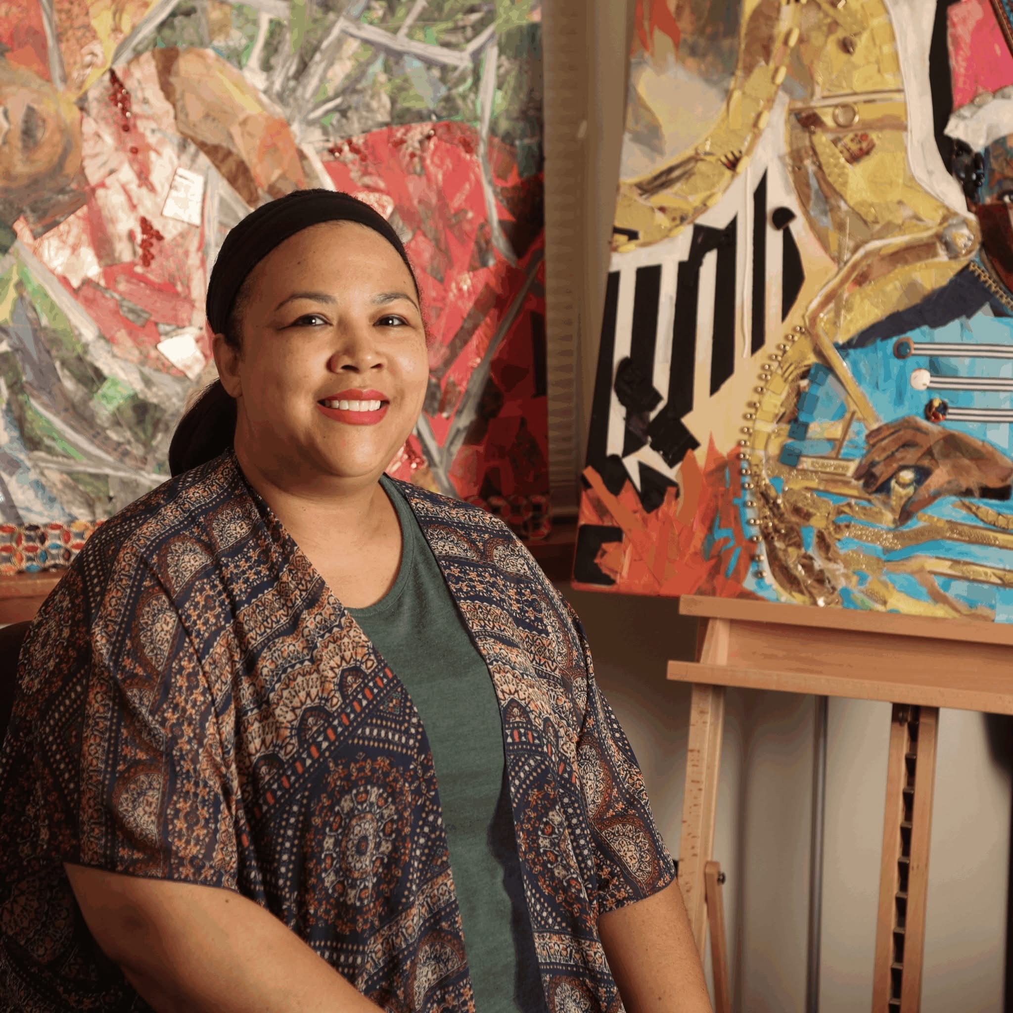 Person smiling in front of art