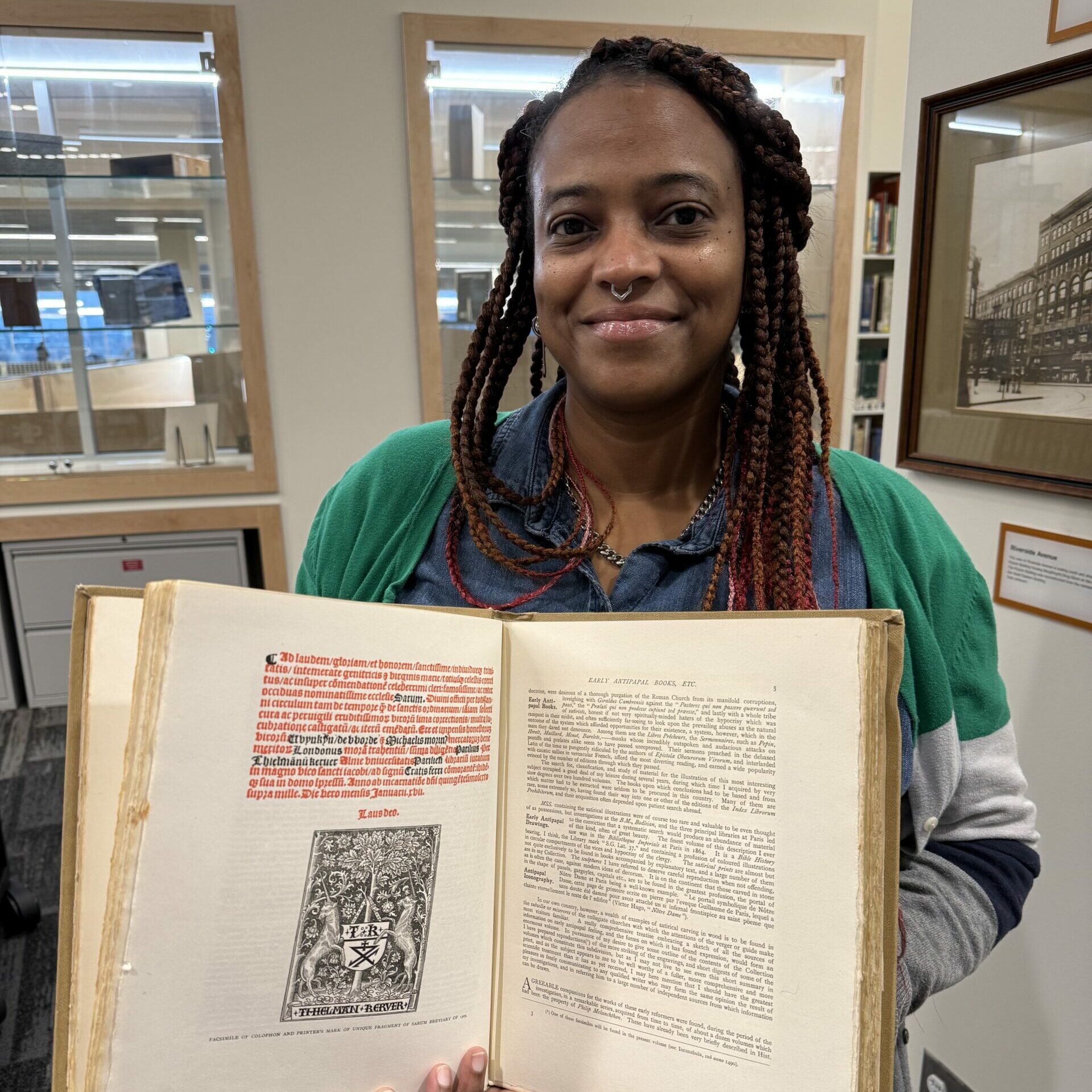 Library customer holds archival materials